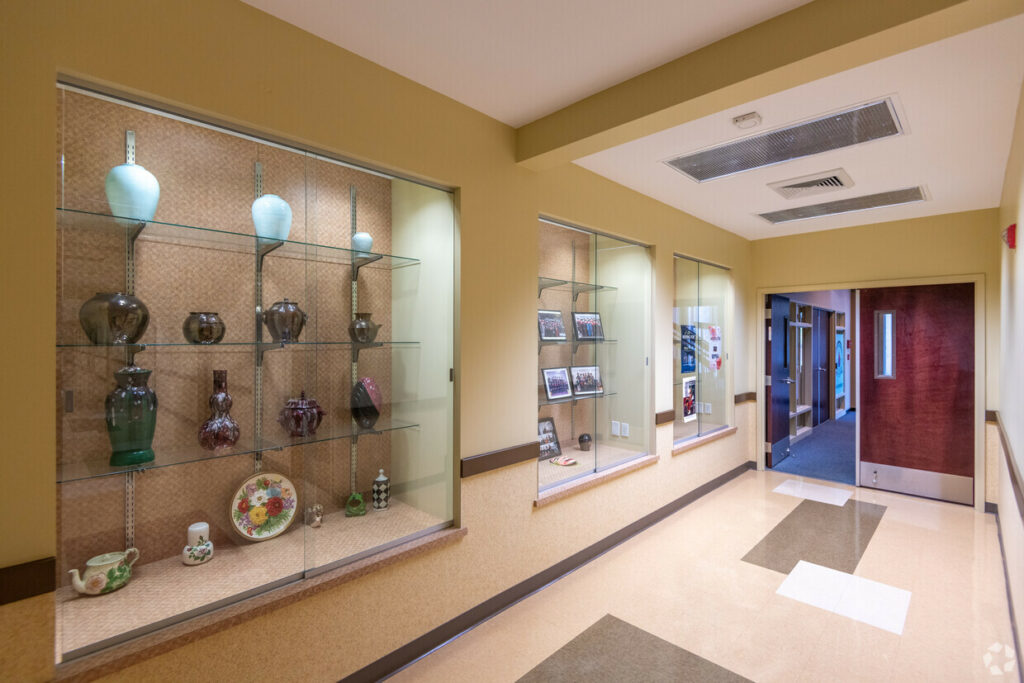 Common hallway with 3 built-in trophy and memorabilia cases.