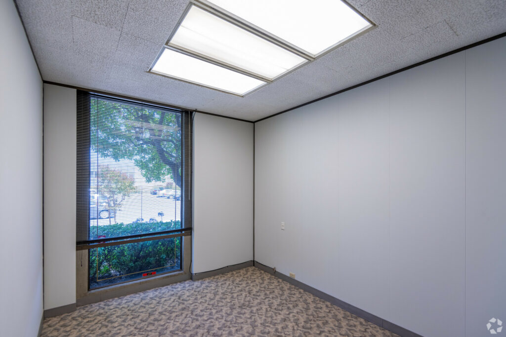 Virtually staged private office with one floor-to-ceiling window in Suite.