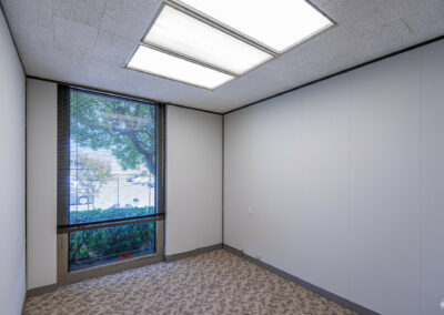 Virtually staged private office with one floor-to-ceiling window in Suite.