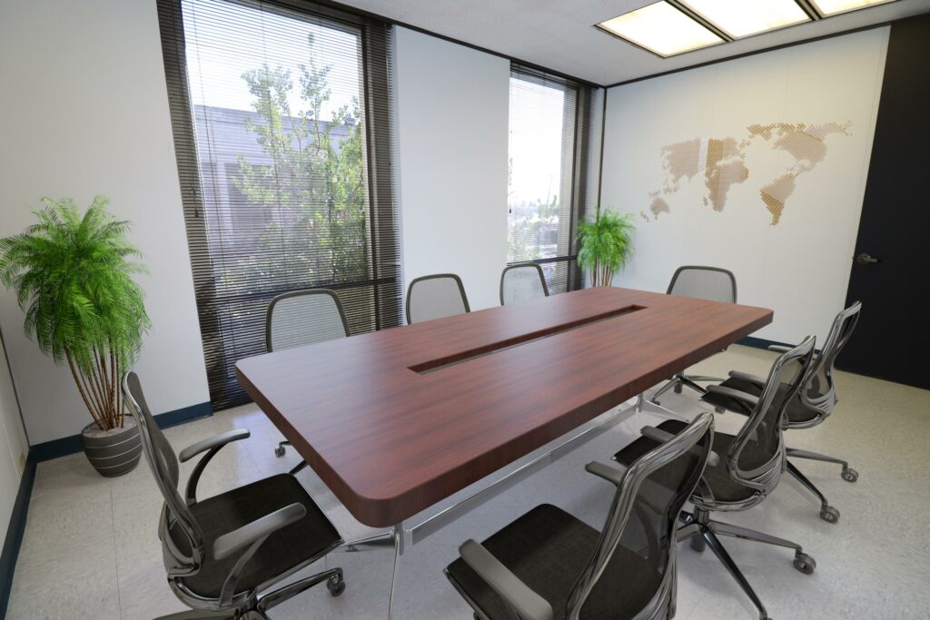 Virtually staged conference room in Suite. Two floor-to-ceiling windows look out on trees and other buildings.