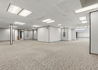 The main open space of Suite. Private offices line the walls.
