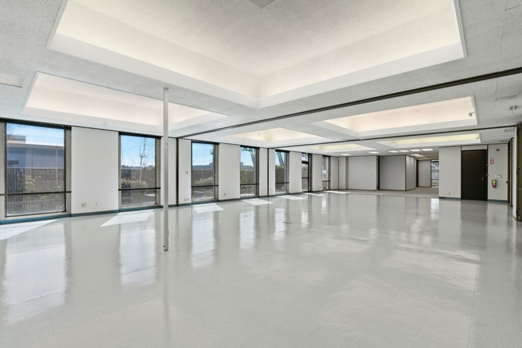 Unfurnished office space with expansive back windows