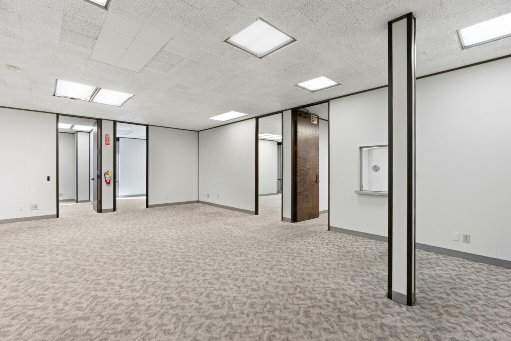 Unfurnished The main open space of Suite. Private offices line the walls. space